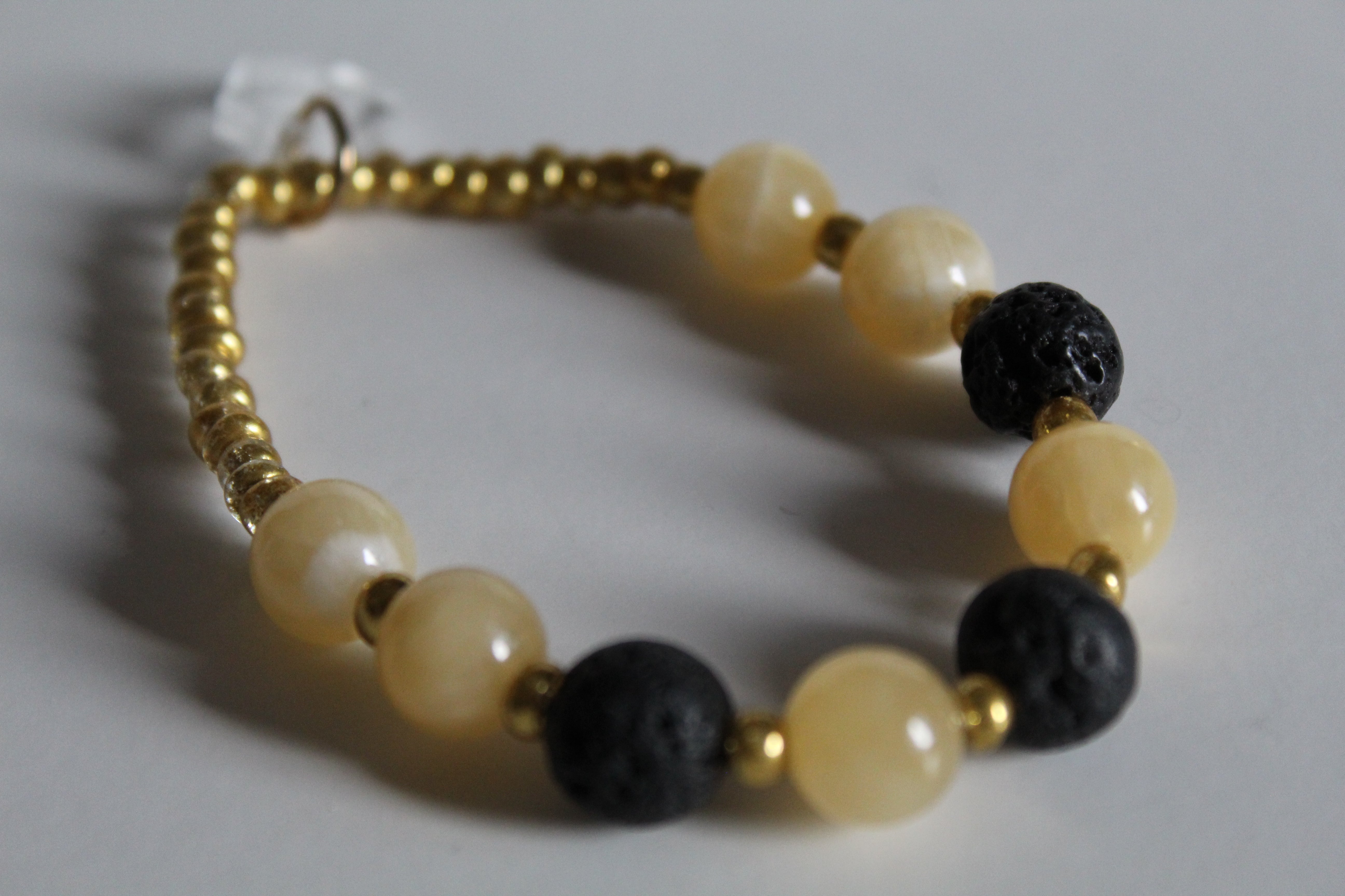 Beautiful Sunfire Calcite and Lava Stretch Bracelet