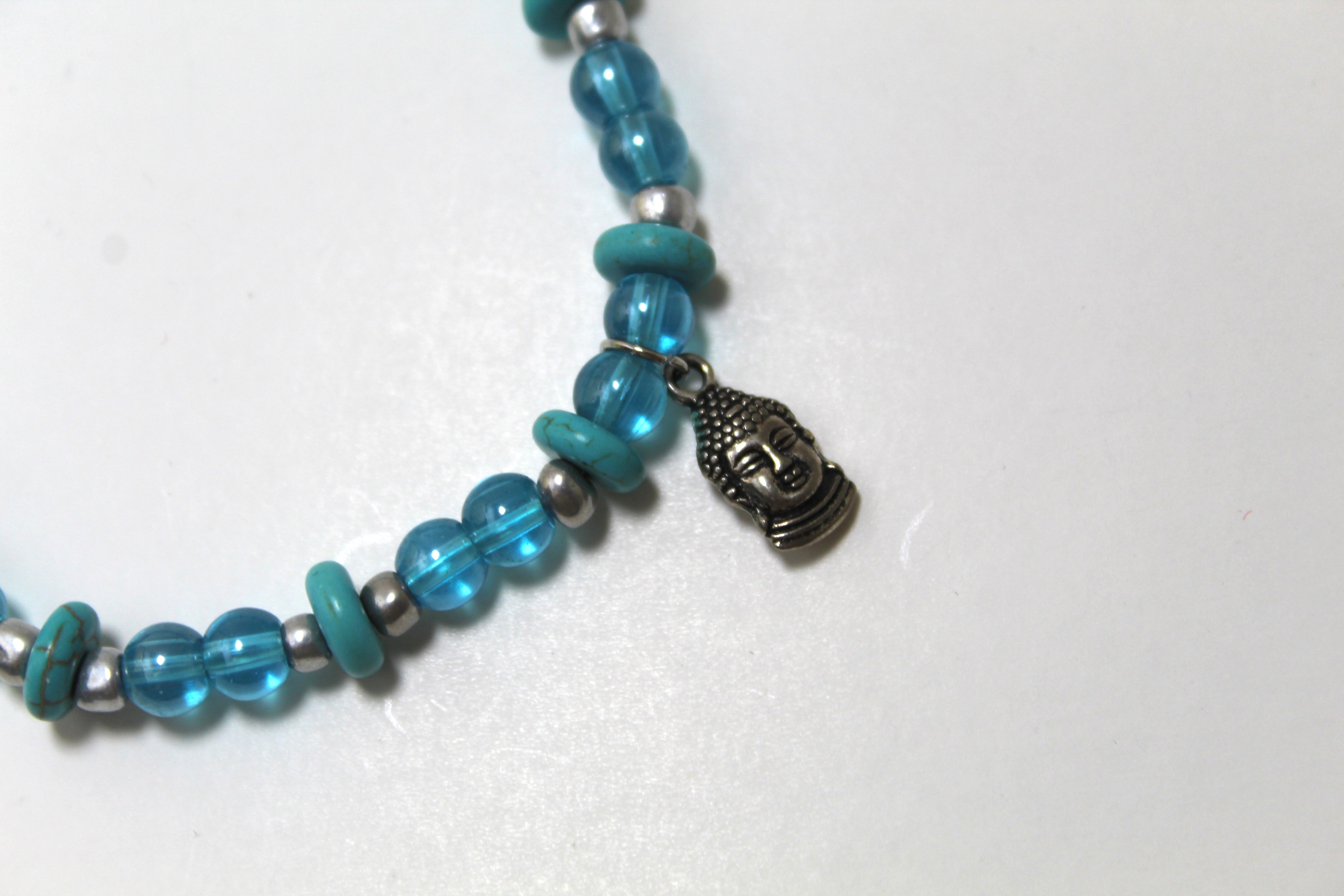 Tranquil Aura: Iridescent Blue Glass Buddha Bracelet